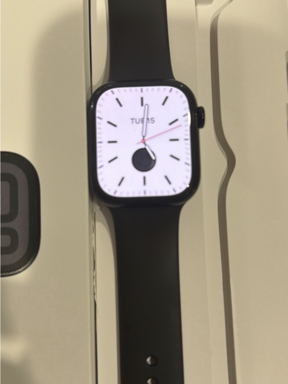 Apple Watch with Black Band and White Digital Face